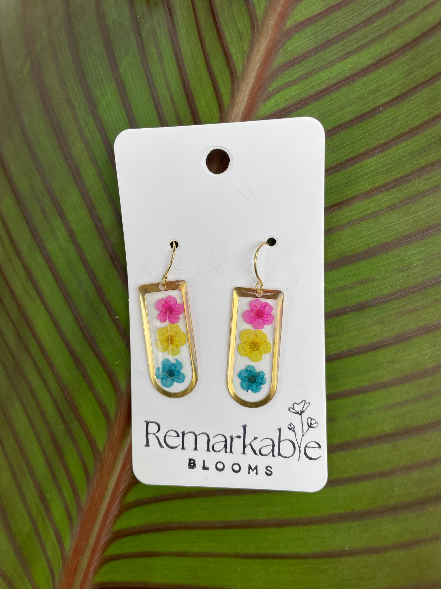 Handmade pink, yellow, and blue Real Pressed Flower Earrings. 14K White and Yellow Gold plated. Pride Earrings.