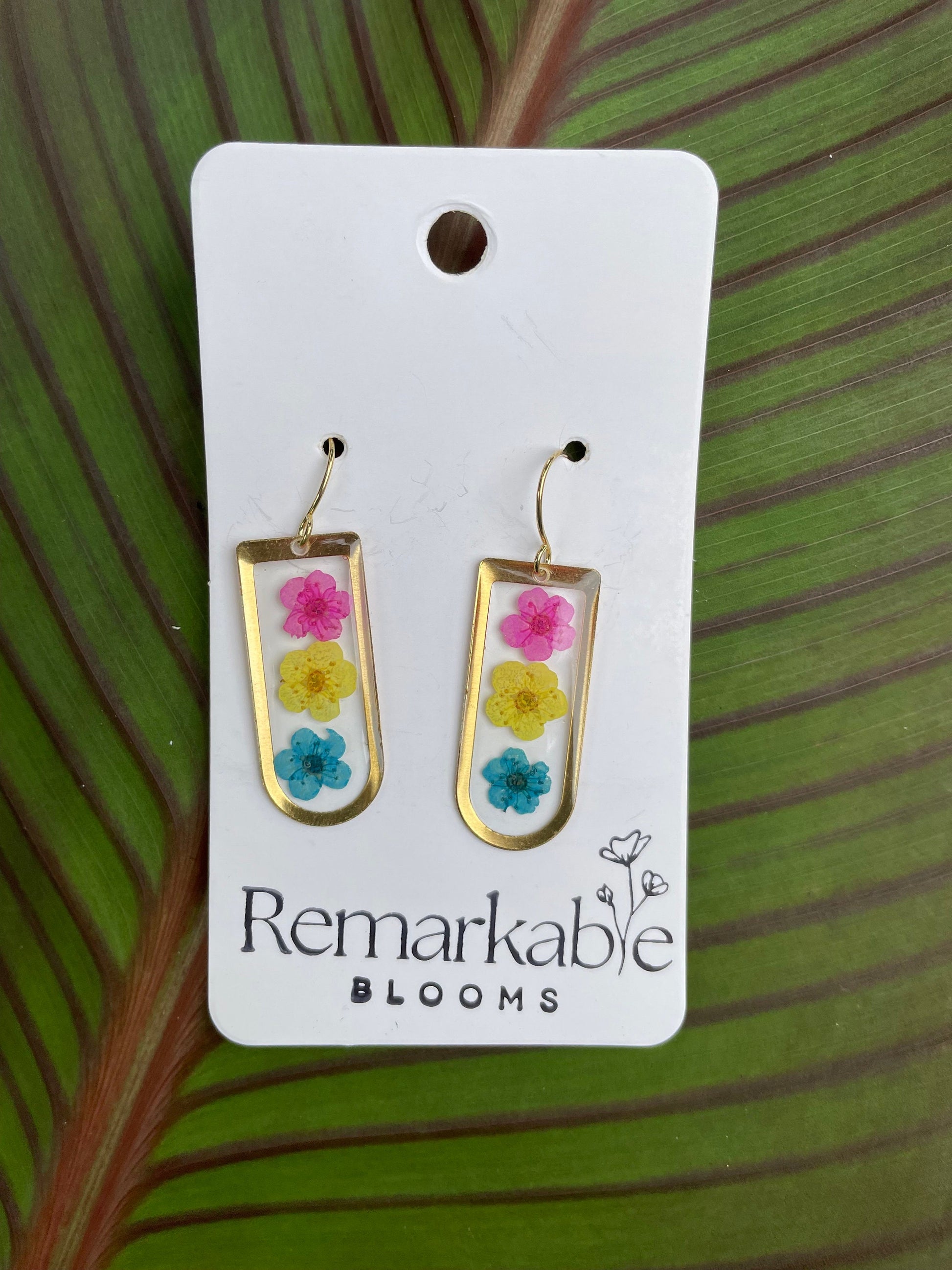 Handmade pink, yellow, and blue Real Pressed Flower Earrings. 14K White and Yellow Gold plated. Pride Earrings.