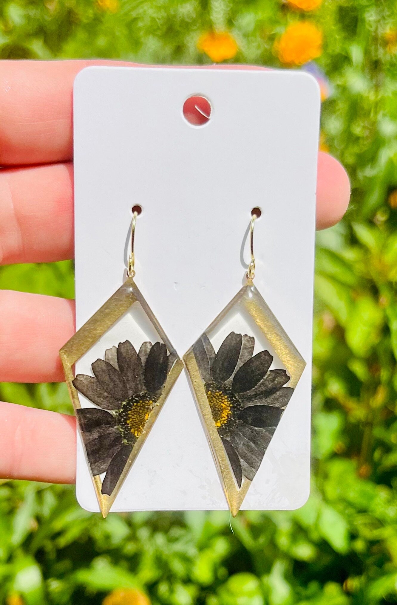 Spooky black daisies earrings. 14 K Gold plated earring hooks.